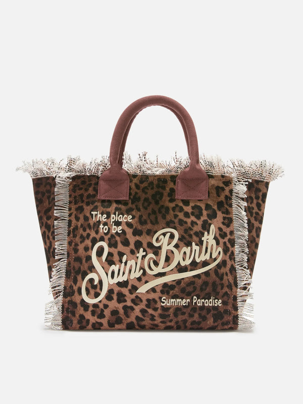 Bolso Vanity de tamaño regular, estampado leopardo en lona, con flecos.